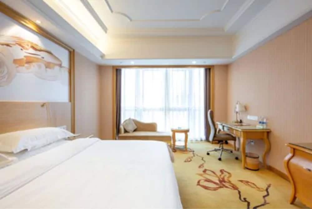 Фото Vienna International Hotel - Ningbo City West Xintiandi