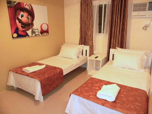 Гостиница Tr3ats Guest House Bohol - Hostel в Тагбиларане