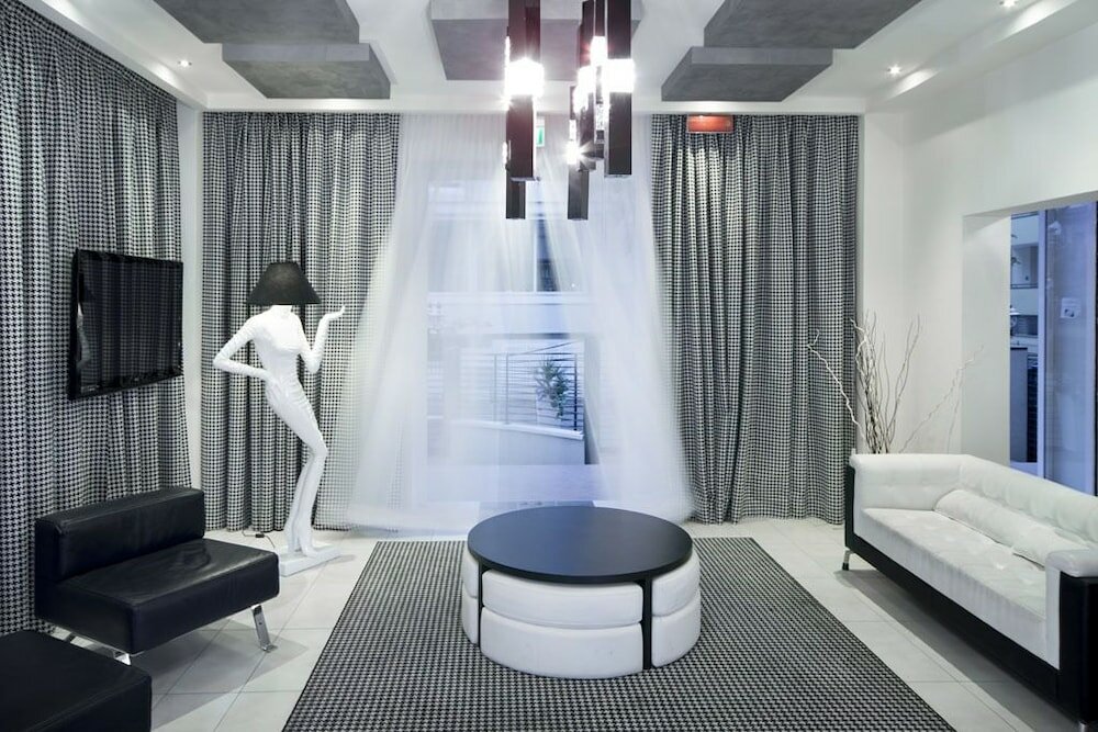 Фото Atmosphere Suite Hotel