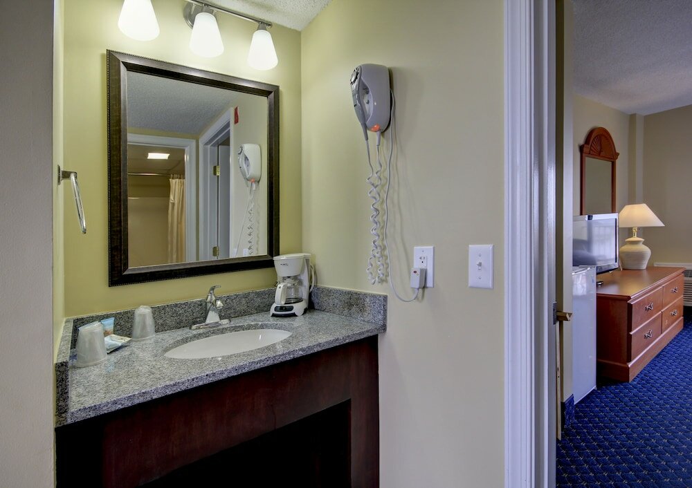 Фото Coastal Palms Inn & Suites