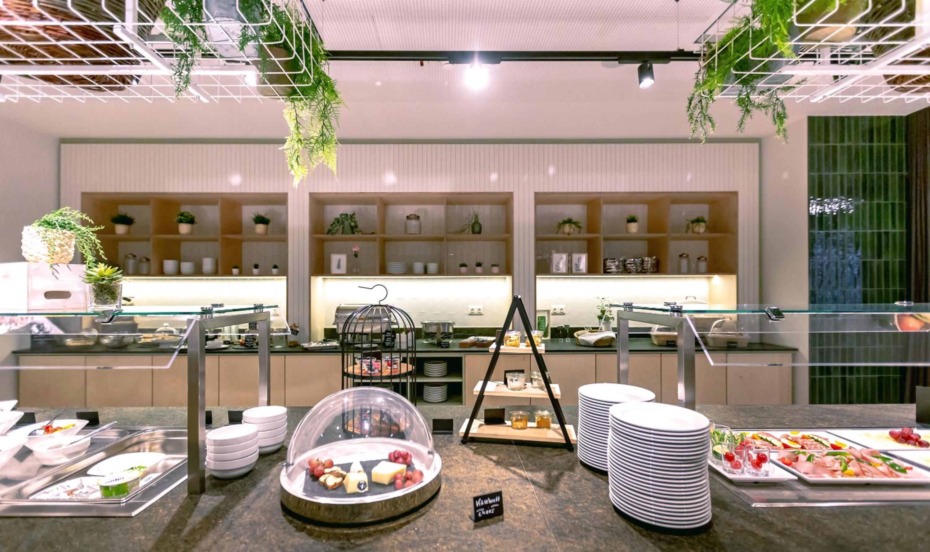 Фото Stadtoase Kolping Hotel