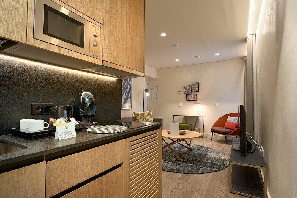 Фото Suites Murillo Plaza Sta Cruz