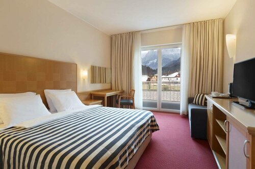 Гостиница Ramada Hotel & Suites by Wyndham Kranjska Gora в Краньска-Горе