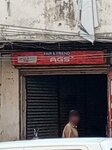 Fria and friend (Province of Sindh, Karachi, Gulshan-e-Iqbal, 5 Block, 4th Street), batteries and chargers