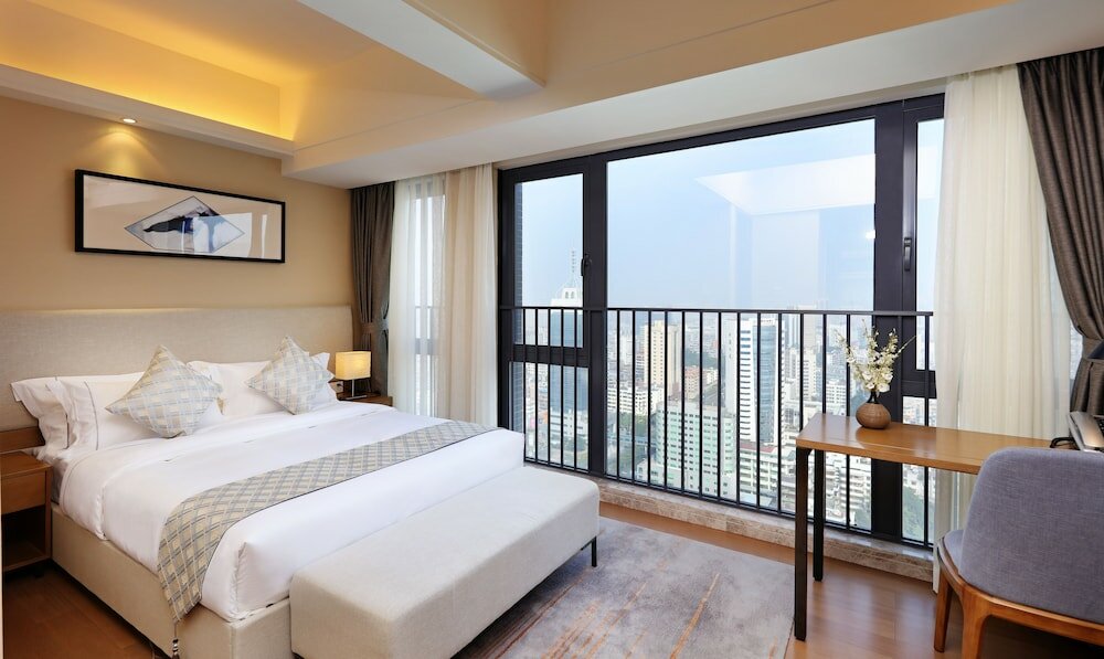 Фото Yuwa Serviced ApartHotel