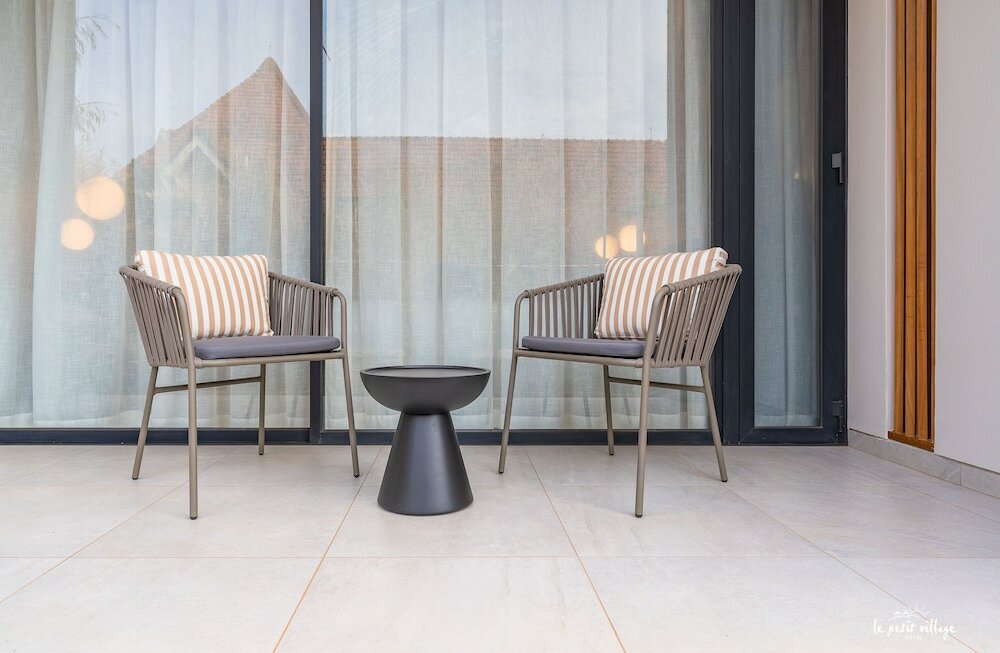 Фото Le Petit Village Hotel