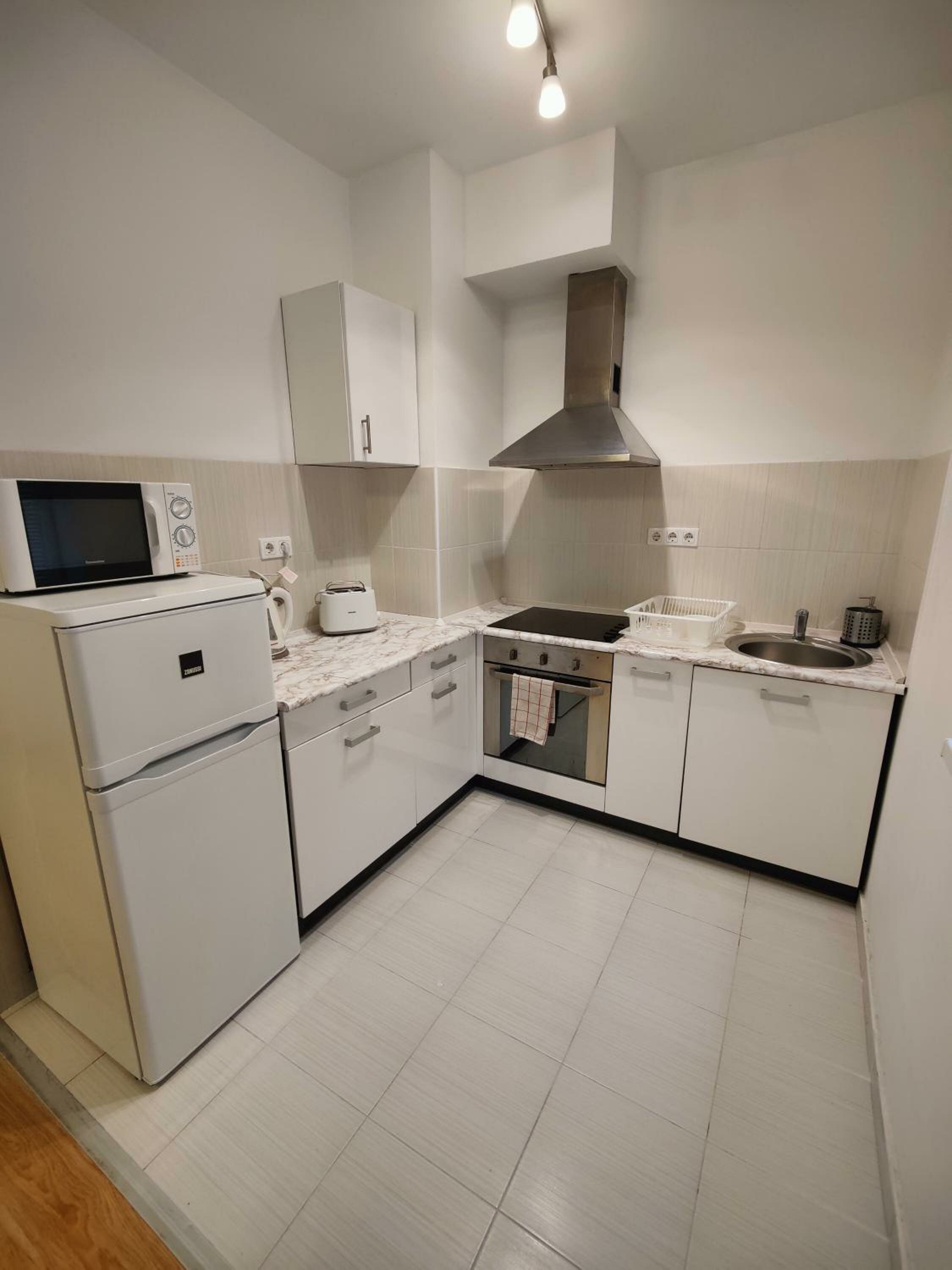Фото Corvin Plaza Apartments and Suites