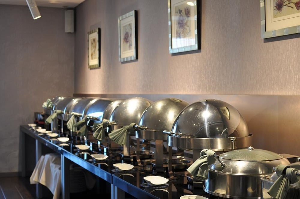 Фото Qingdao Housing International Hotel