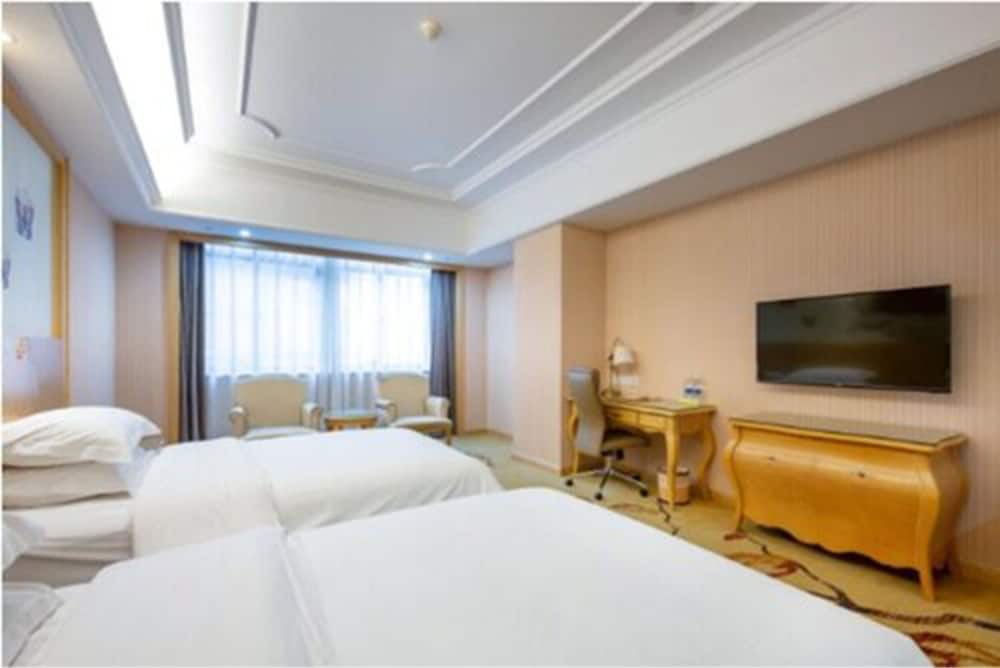 Фото Vienna International Hotel - Ningbo City West Xintiandi