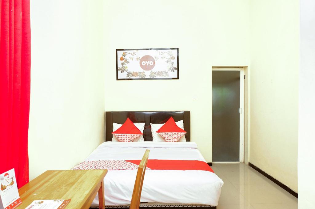 Фото Oyo 314 Emas 23 Guest House Syariah