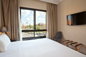 Гостиница Amani Hotel Suites & SPA