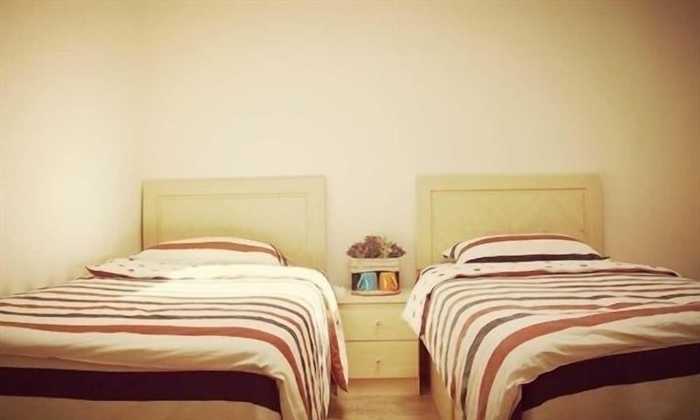 Фото Qingdao Yuezhu Topic Hostel