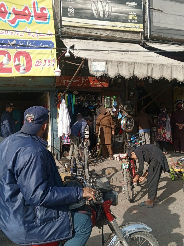 Bicycle repair M Sharif Cycle Works, Lahore, photo