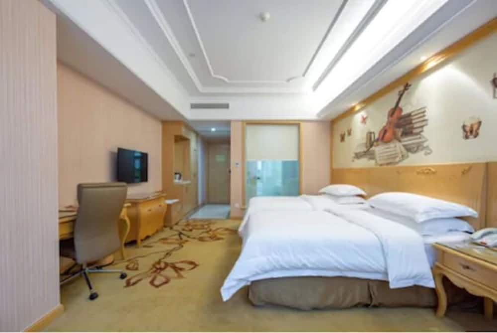 Фото Vienna International Hotel - Ningbo City West Xintiandi