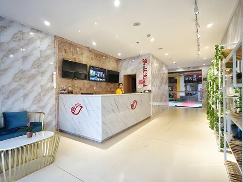Гостиница Shell Shanghai Baoshan District Songbin Road Subway Station Hotel в Шанхае