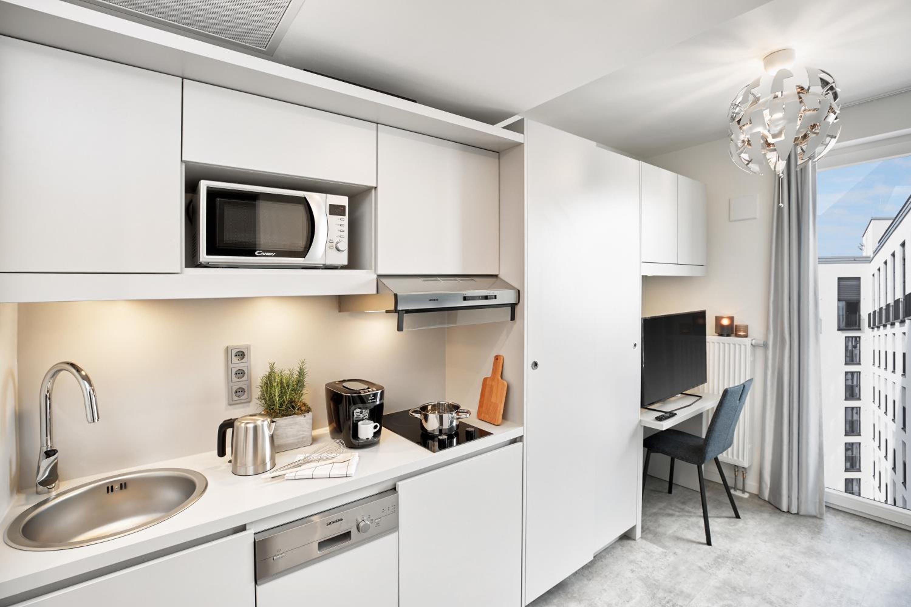 Фото H. ome Serviced Apartments München