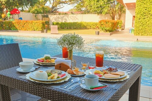 Внешний вид отеля Holiday Suites Hotel & Resort в Пуэрто-Принсесе, фото 3