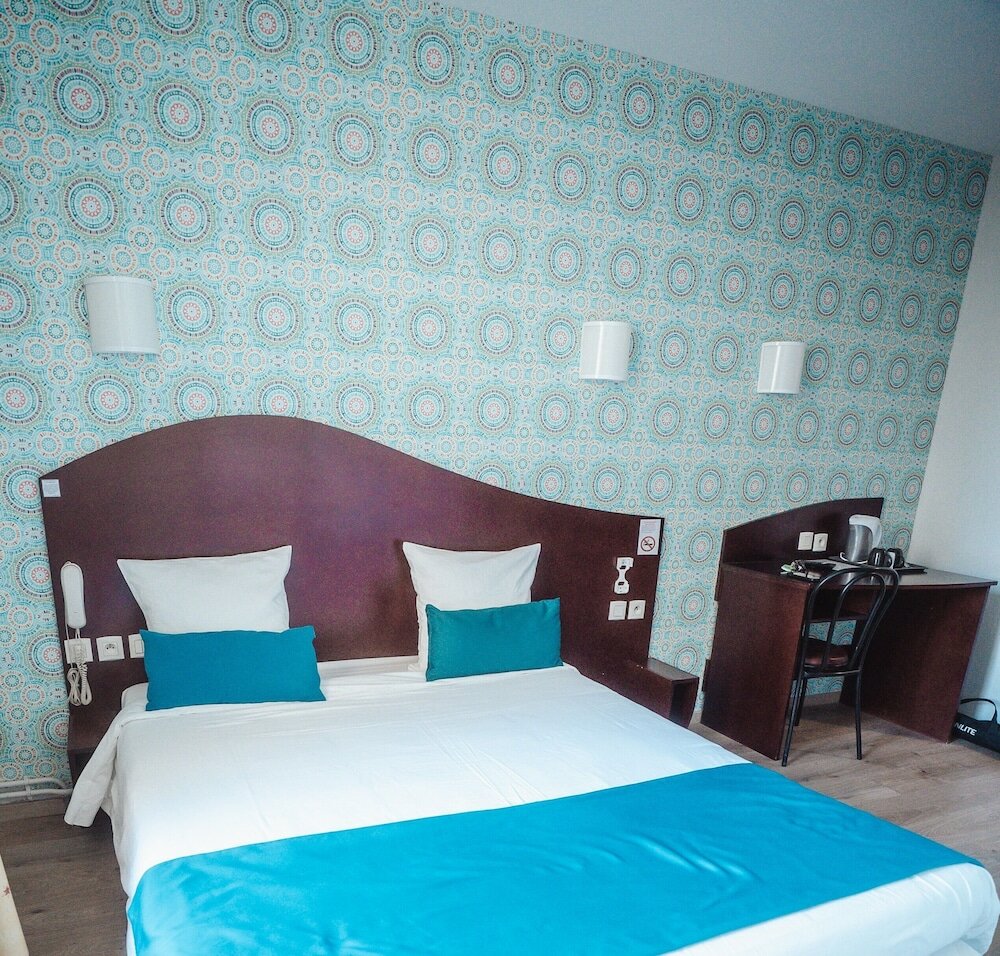 Фото Hôtel Les Commerçants