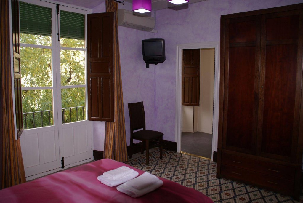 Фото La Perla Granada Suites