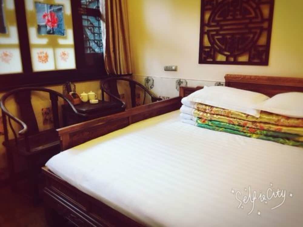 Фото Pingyao Hongyuyuan Inn