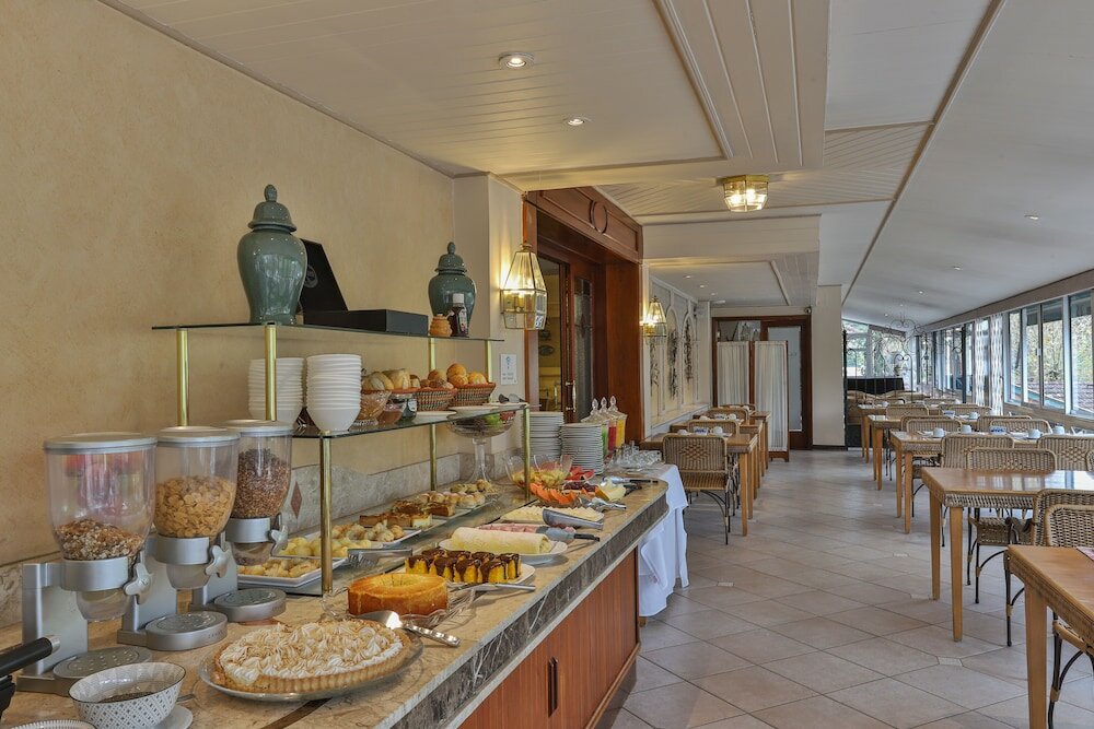 Фото Le Suisse Elegance Hotel