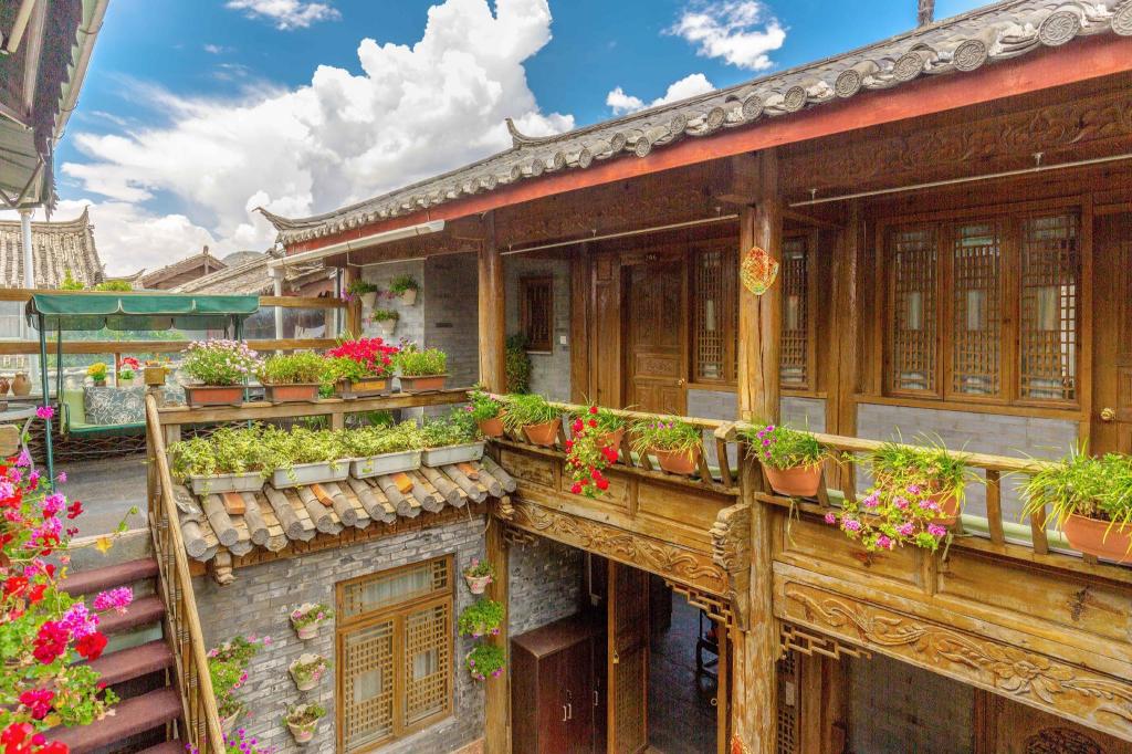 Фото Li Jiang Hemuju Inn