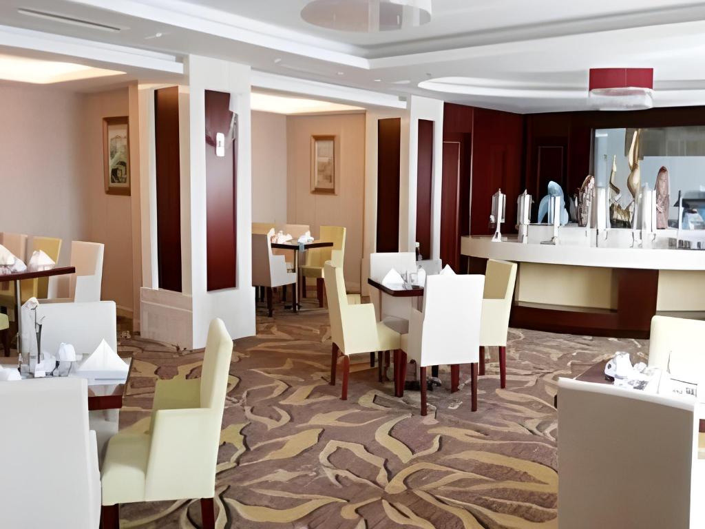 Фото Qingdao Huaxi Hotel