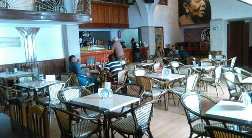 Гостиница Café Royal Suites в Минделу