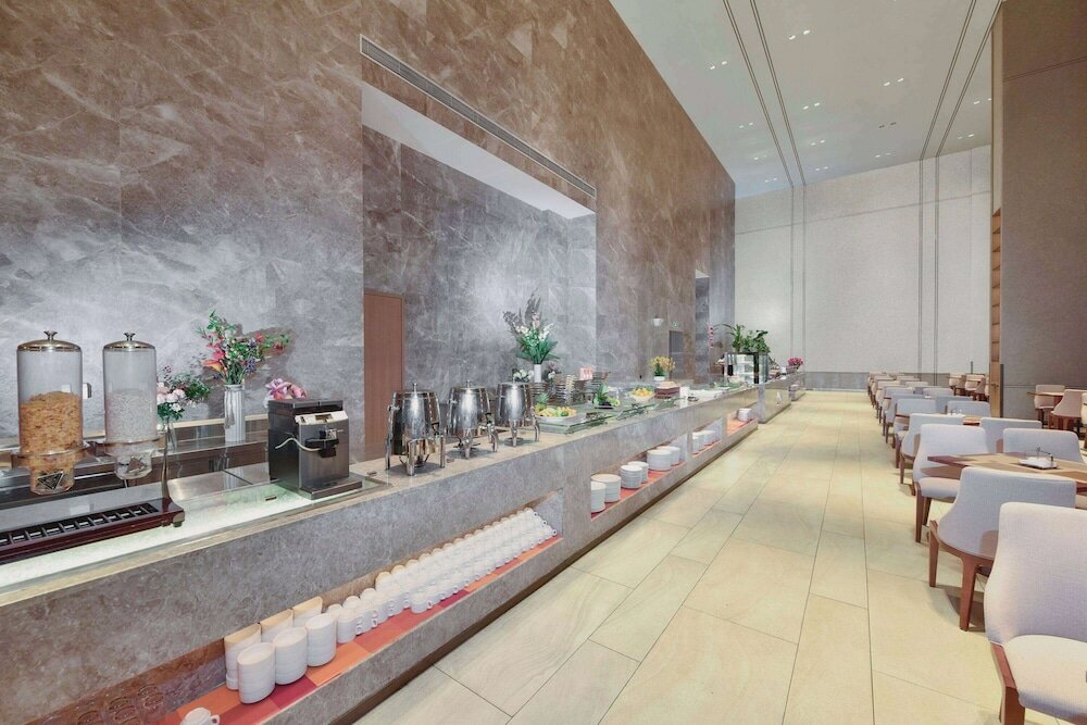 Фото Ramada Plaza Dongxing City Center