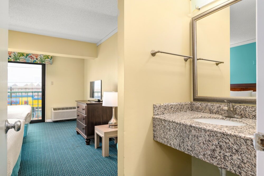 Фото Cayman Suites Hotel