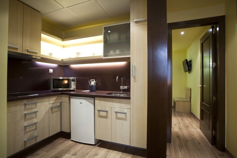 Фото Suites Gran VIA 44 Apartahotel