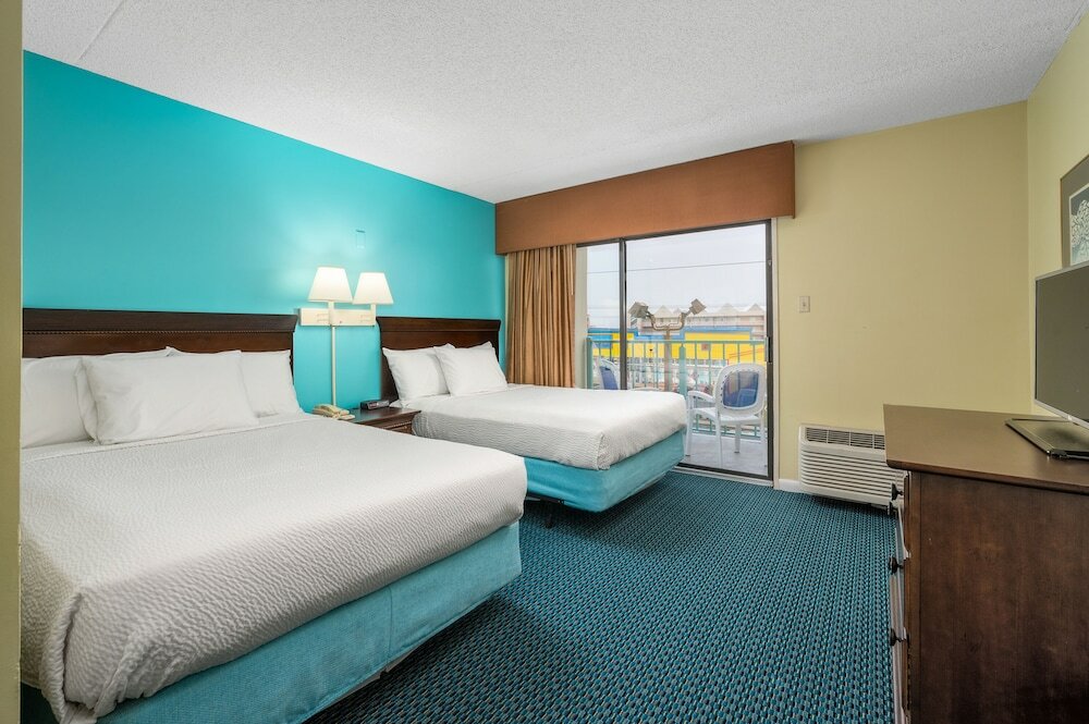 Фото Cayman Suites Hotel