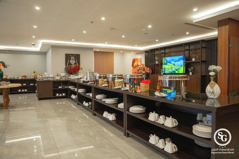 Фото Signature Guest Hotel