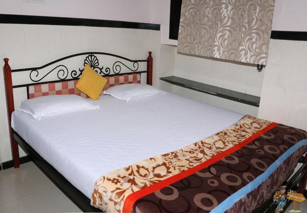 Фото Travellers Inn Mumbai