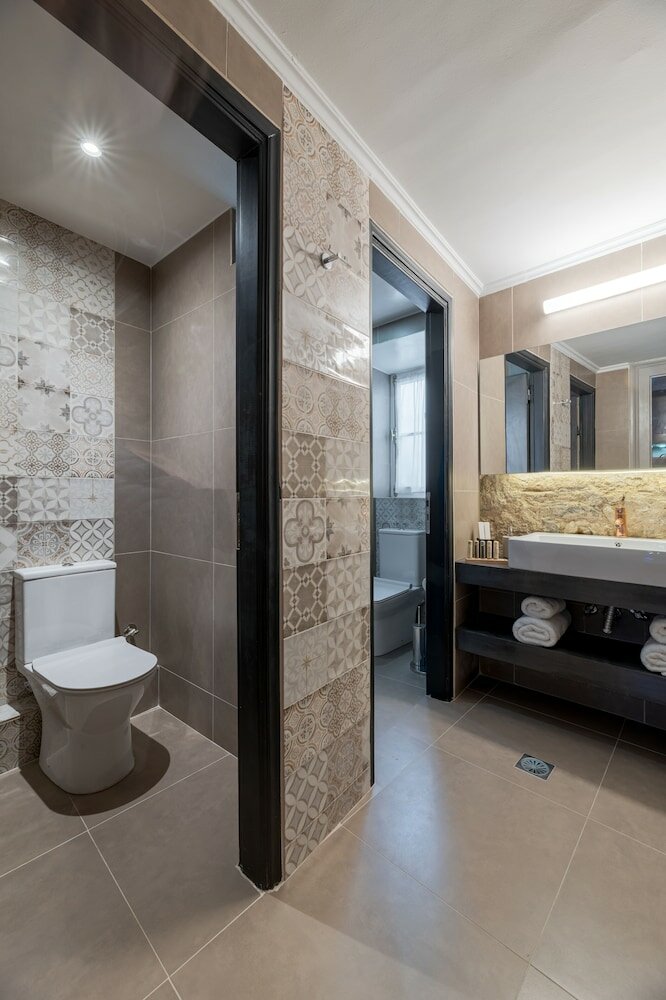 Фото 2 Mazi Suites