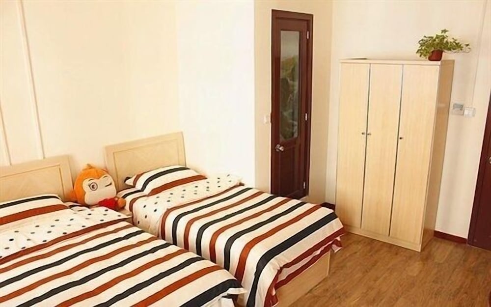 Фото Qingdao Yuezhu Topic Hostel