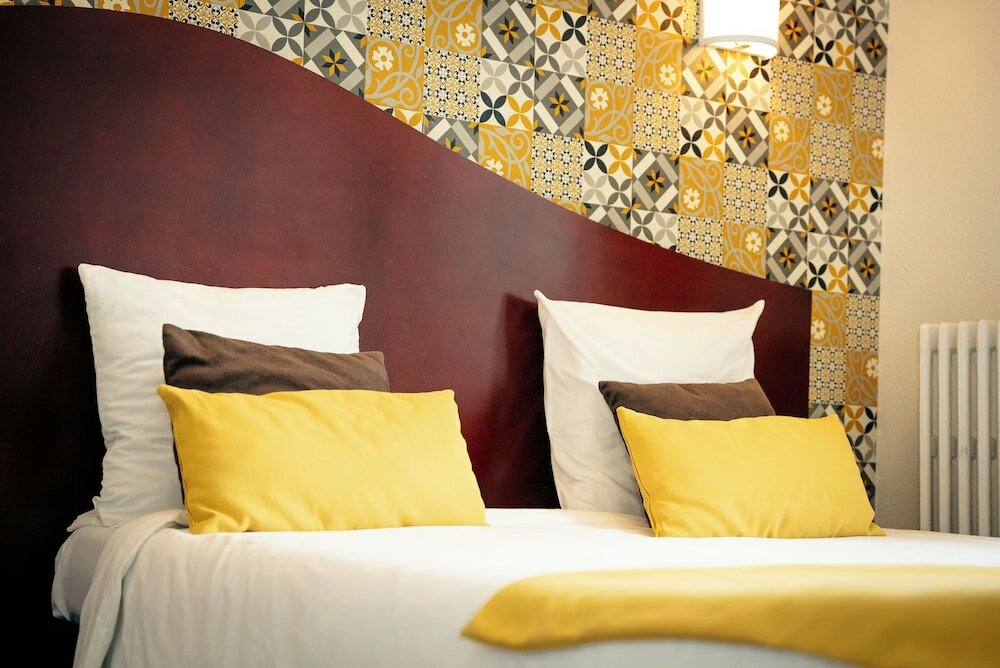 Фото Hôtel Les Commerçants