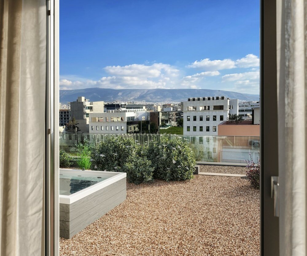 Фото Athens Hill Luxury Apartments