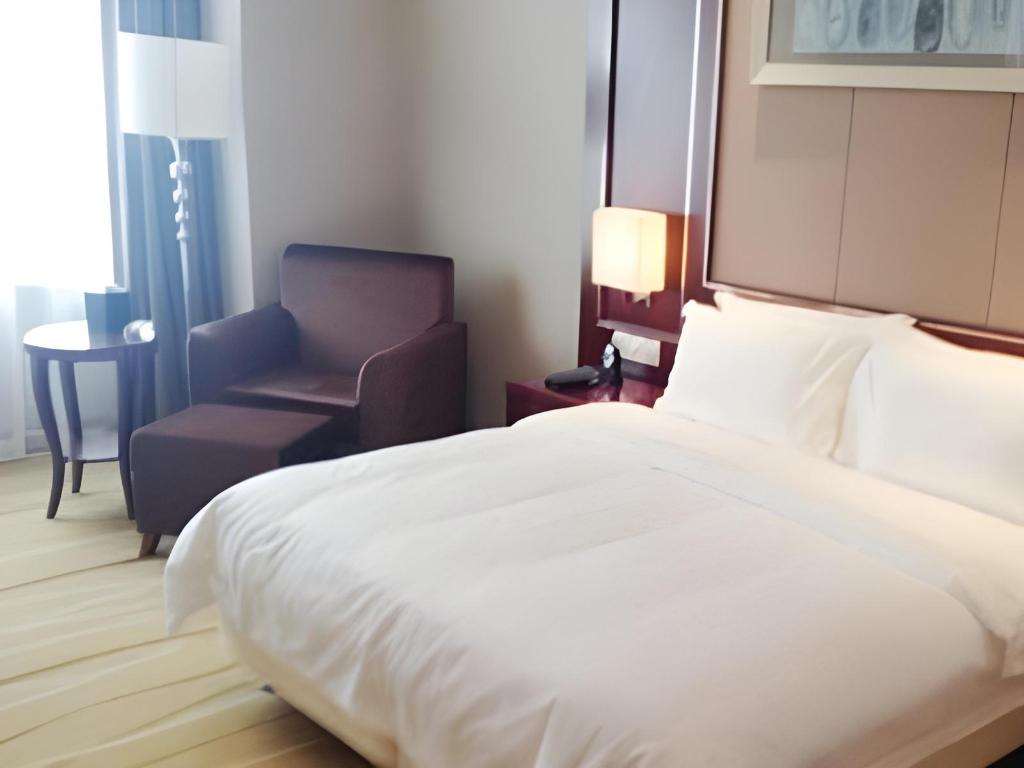 Фото Qingdao Huaxi Hotel