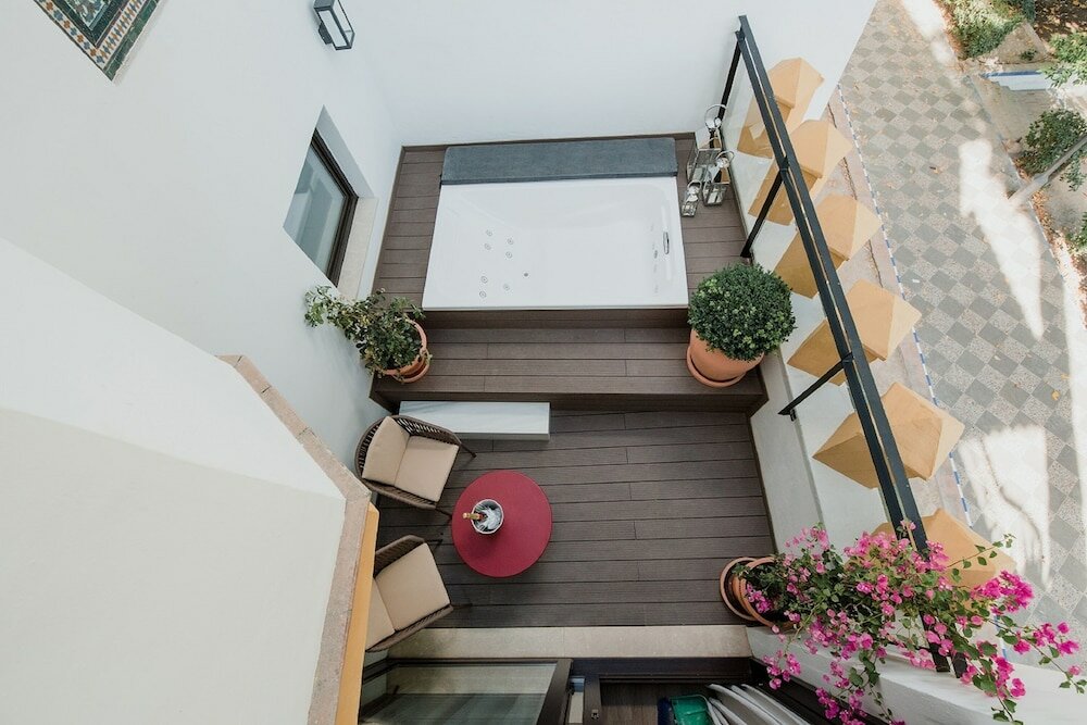 Фото Suites Murillo Plaza Sta Cruz