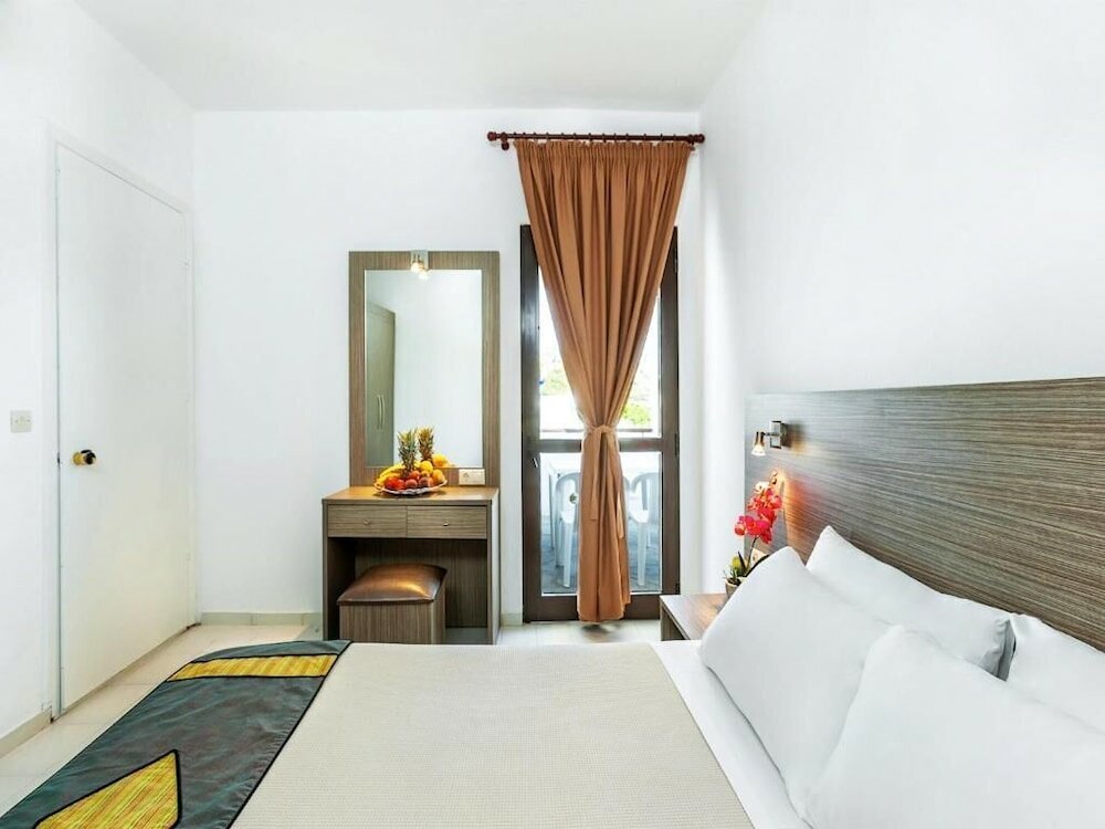 Фото Xenios Dolphin Beach Hotel