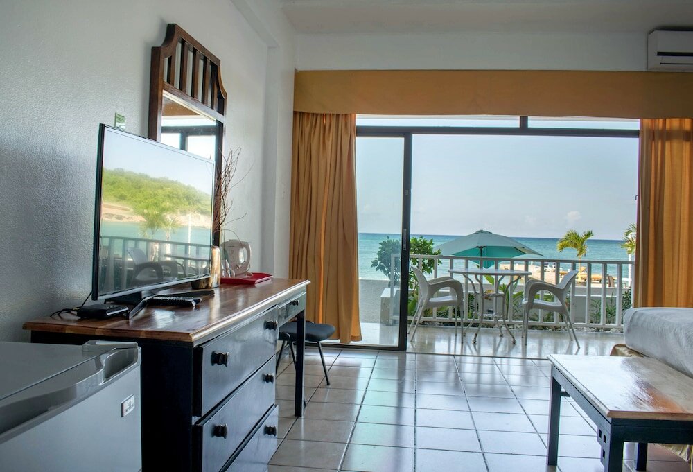 Фото Sand And Tan Beach Hotel