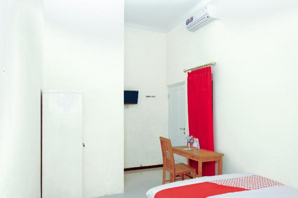 Фото Oyo 314 Emas 23 Guest House Syariah