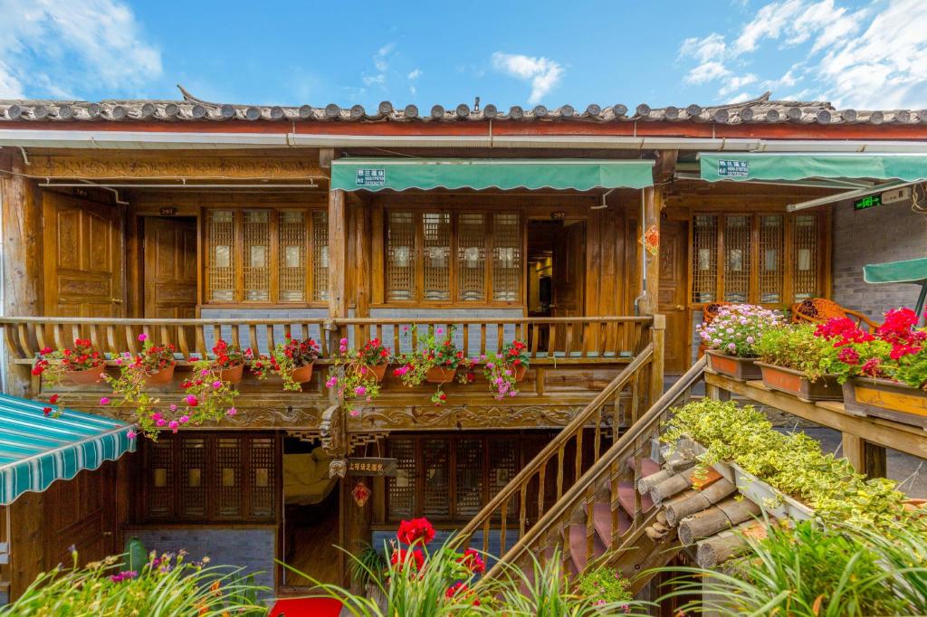 Фото Li Jiang Hemuju Inn