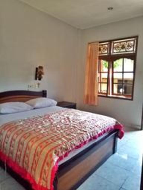 Фото Taman Mekar Beach Inn 2