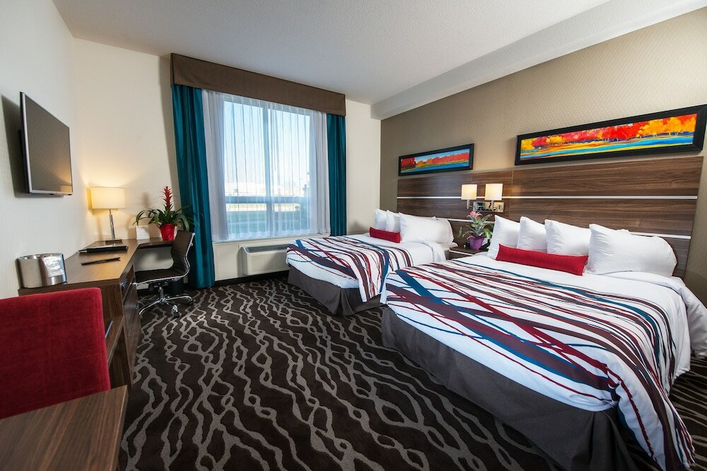 Фото Encore Suites by Service Plus Inns