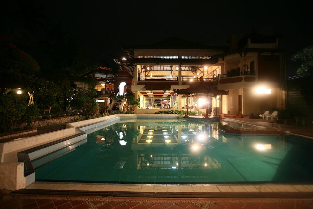 Фото Puri Naga Beachfront Cottages