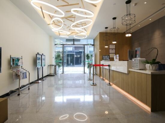 Фото Shenzhen Songgang Manjinghua Lepin Hotel