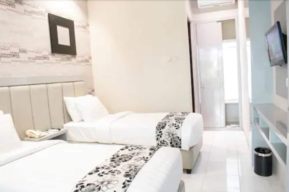 Фото Luminor Hotel Jember