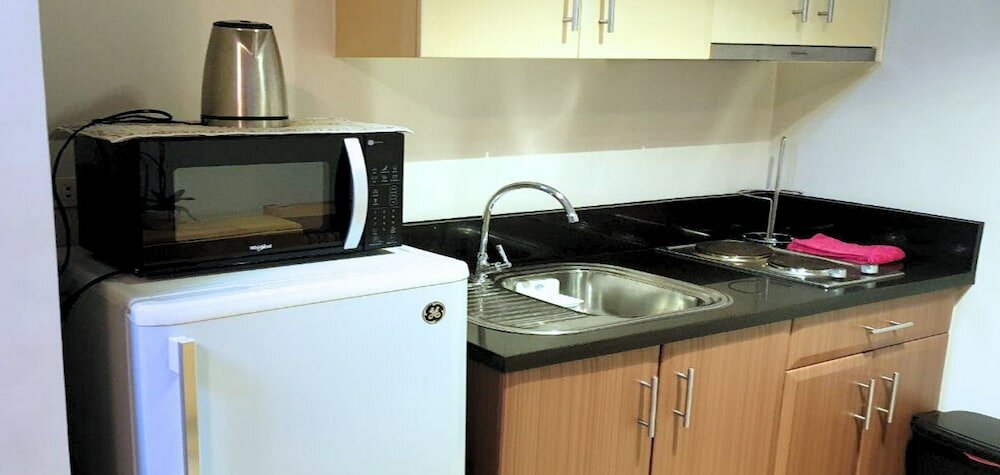 Фото Tess and Tessha Condotel near T3 Airport